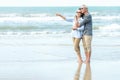 Asian Lifestyle senior couple hug on the beach happy in love romantic and relax time Royalty Free Stock Photo